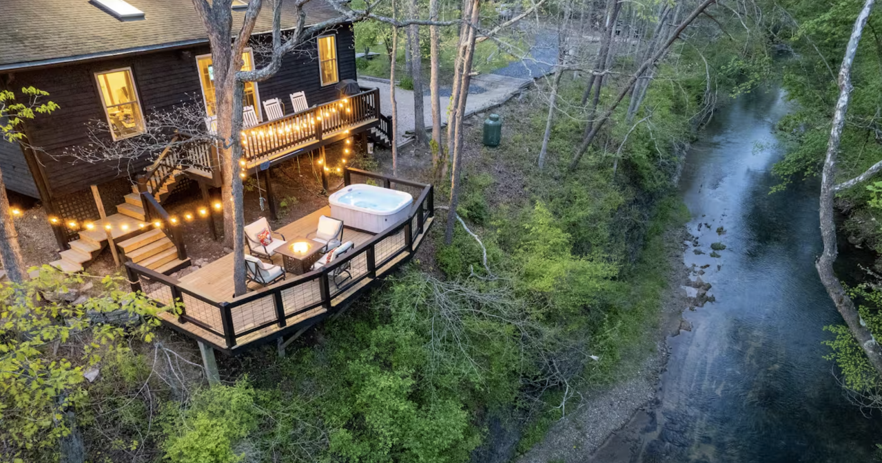 balony of a home overlooking a running river